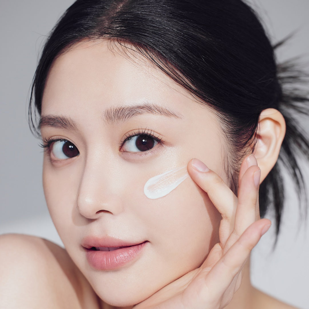 The appearance of a woman wearing makeup for the best Korean foundation for a dewy look.