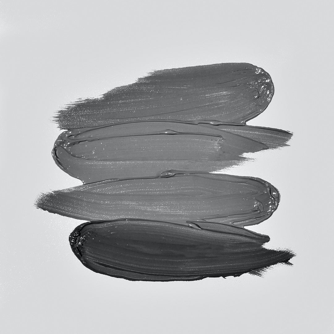 Four black and white shades of cream that can show the moisture of foundation