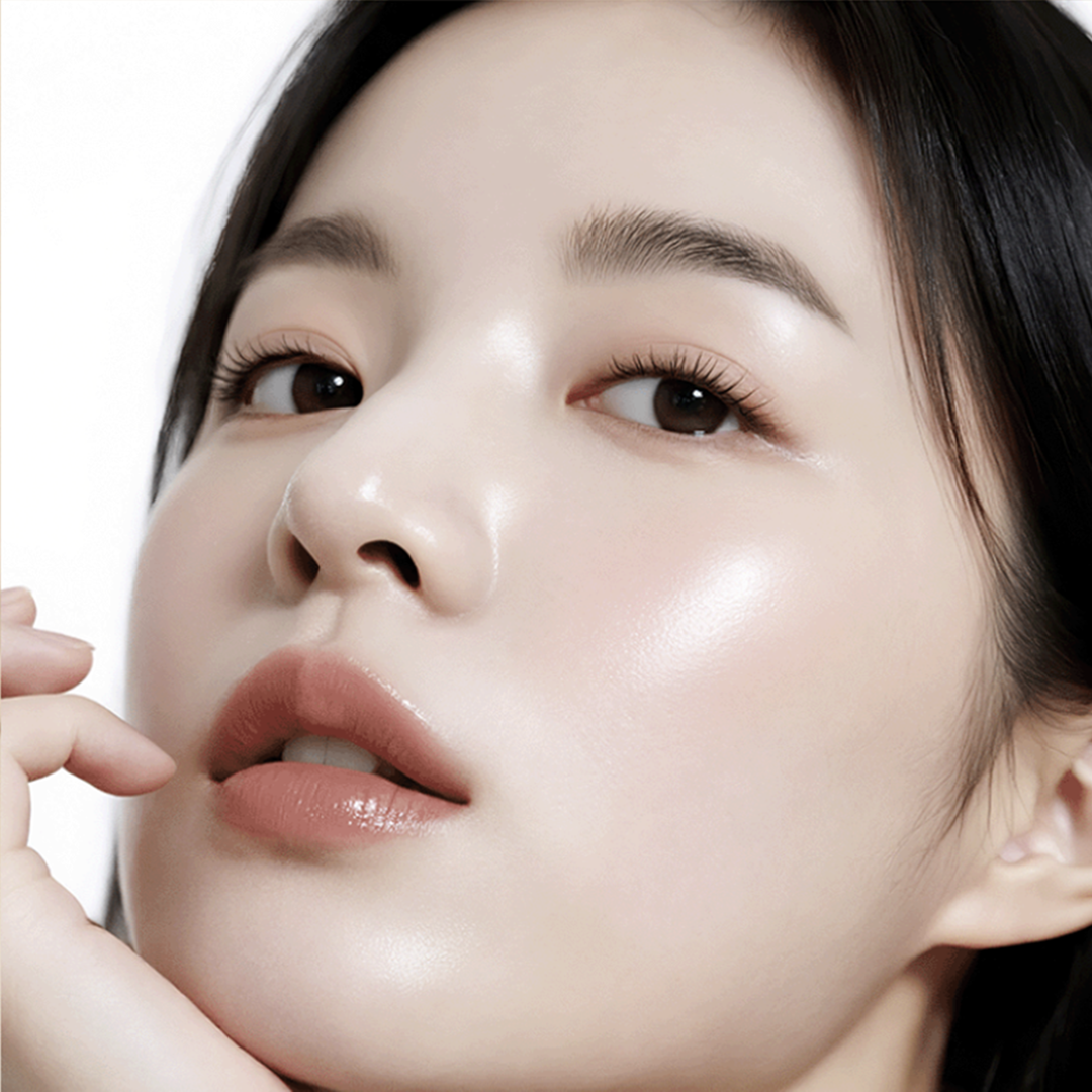 Close-up of a person's face with a neutral expression VINNE Cushion Foundation #21 Light Beige for flawless glass skin finish